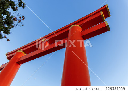 Low angle view of Heian Jingu torii gate with blue sky 129583639
