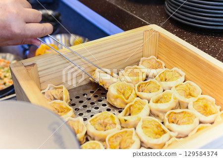 Asian traditional food. Korean style dumplings Asian traditional food. Korean style dumplings 129584374