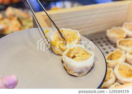 Asian traditional food. Korean style dumplings Asian traditional food. Korean style dumplings 129584379
