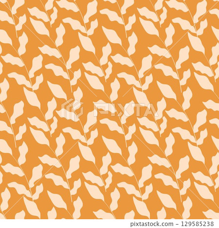 Silhouette of leaves on orange warm background Silhouette of leaves on orange warm background 129585238