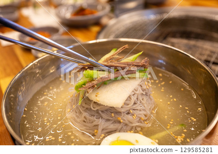 Korean traditional food. Cold buckwheat noodles Korean traditional food. Cold buckwheat noodles 129585281