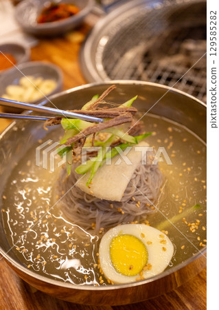Korean traditional food. Cold buckwheat noodles 129585282