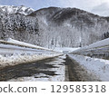 A bridge in the snow with guardrails on both sides 129585318