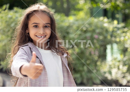 Pretty long-haired girl feeling excited and happy Pretty long-haired girl feeling excited and happy 129585735