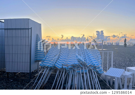Black Sea Beach and Sky Clouds During Sunset 129586014