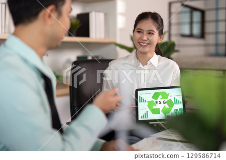 Engaging ESG presentation by professionals in a bright office Engaging ESG presentation by professionals in a bright office 129586714