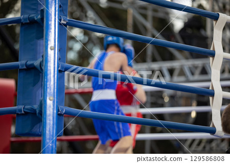 Boxing fight in the ring at competitions 129586808