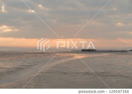 Arao City coast at dusk 129587168