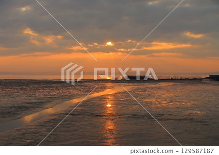 Arao City coast at dusk 129587187