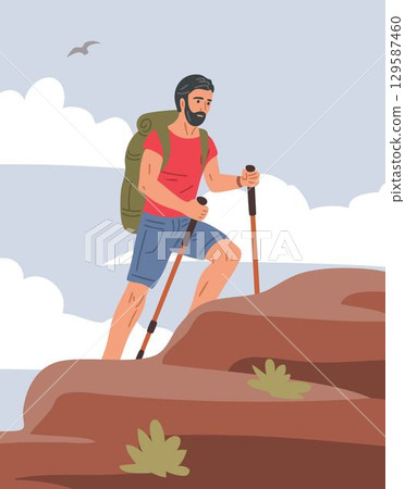 Man hiking uphill with trekking poles, summer mountain adventure 129587460