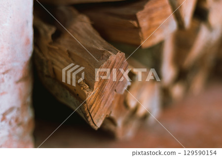 Pile of chopped fire wood prepared for winter 129590154