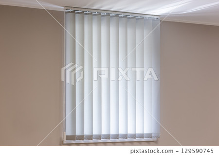 Closed Vertical Blinds in Minimalist Interior 129590745