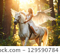 Horse and angel illuminated by the setting sun 129590784