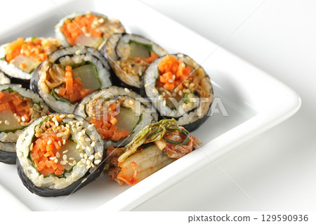 Korean-style seaweed roll kimbap photographed on white background 129590936