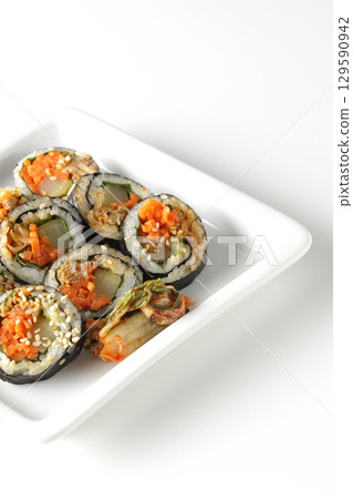 Korean-style seaweed roll kimbap photographed on white background 129590942