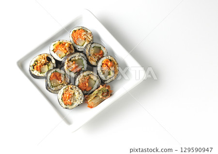 Korean-style seaweed roll kimbap photographed on white background Korean-style seaweed roll kimbap photographed on white background 129590947