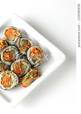 Korean-style seaweed roll kimbap photographed on white background 129590956