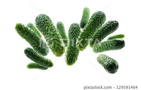 Green cucumbers levitate on a white background 129591484