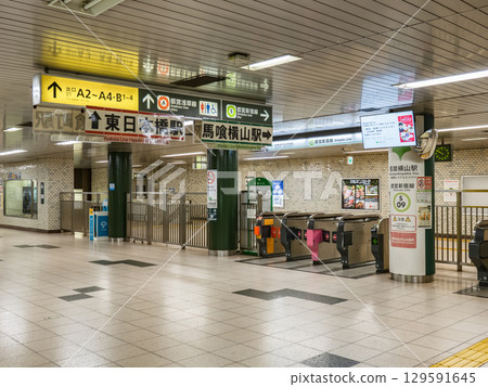 Ticket gate and information sign at Bakuroyokoyama Station on the Toei Shinjuku Line Ticket gate and information sign at Bakuroyokoyama Station on the Toei Shinjuku Line 129591645