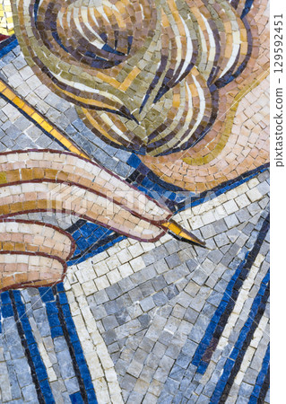Close-up of Ancient Mosaic Art with Hand and Stylus Close-up of Ancient Mosaic Art with Hand and Stylus 129592451