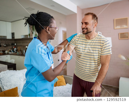 Nurse provides support and encouragement to patient Nurse provides support and encouragement to patient 129592519