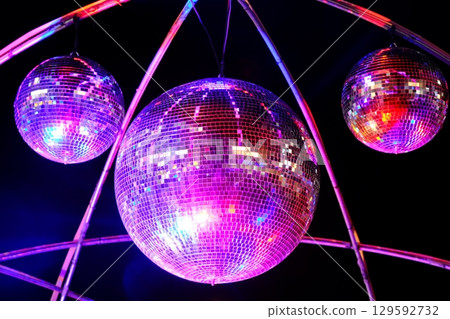 A mirror ball illuminated by illuminations 129592732