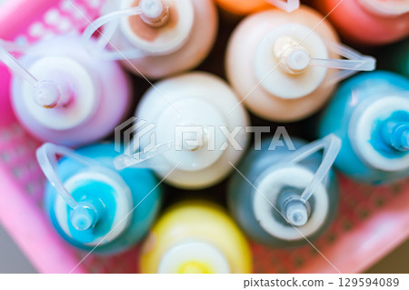 Close up transparent bottle acrylic paint Close up transparent bottle acrylic paint 129594089