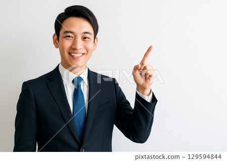 A businessman showing "This is the point!" 129594844