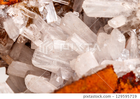 Macro mineral stone crystals Hemimorphite rock on a white background 129595719