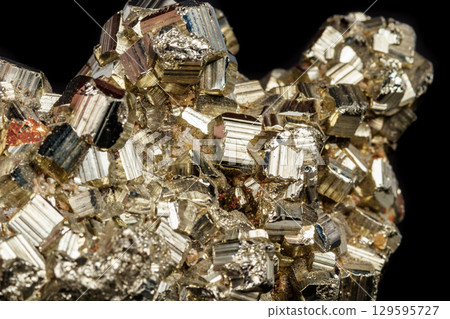 Macro mineral stone Pyrite on a black background 129595727