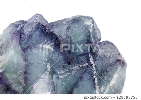 Macro mineral stone Fluorite on white background Macro mineral stone Fluorite on white background 129595755