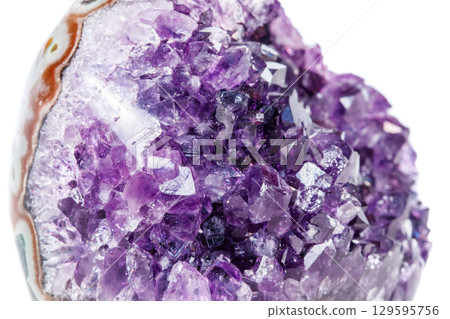 Amethyst Crystal Druse macro mineral on white background Amethyst Crystal Druse macro mineral on white background 129595756
