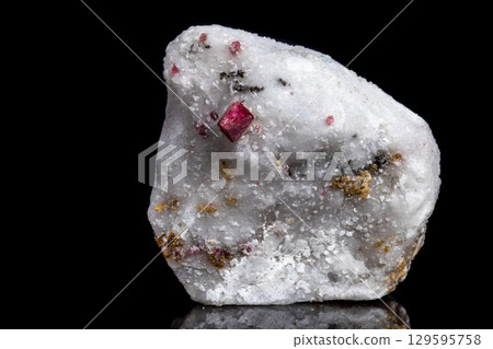 Macro mineral stone Spinel on a black background Macro mineral stone Spinel on a black background 129595758