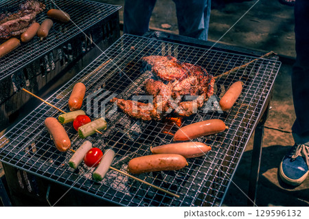 Image of charcoal grilled meat on barbecue 129596132