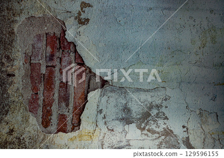 Cracked wall illuminated by light Cracked wall illuminated by light 129596155