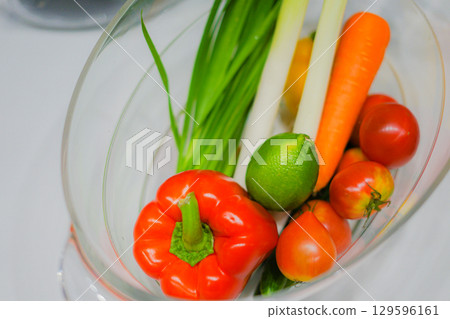 Green-yellow vegetables in a wine cooler Green-yellow vegetables in a wine cooler 129596161