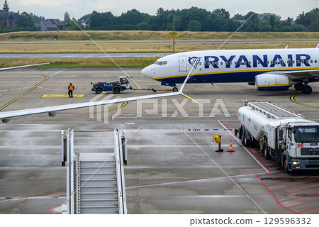Ryanair Irish ultra low-cost airline airplane on the tarmac of Brussels South Charleroi Airport in Charleroi, Belgium Ryanair Irish ultra low-cost airline airplane on the tarmac of Brussels South Charleroi Airport in Charleroi, Belgium 129596332