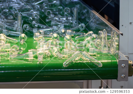 The raw material for plastic bottle manufacturing process. 129596353