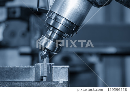 The chamfering process on NC milling machine with chamfer tools in the light blue scene. The chamfering process on NC milling machine with chamfer tools in the light blue scene. 129596358