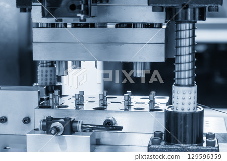 The metal parts mass production by progressive die in the light blue scene. 129596359