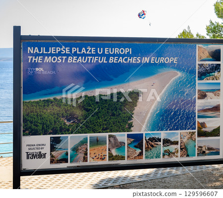 Signboard information about local beaches at the Zlatni Rat Golden cape beach on the Adriatic island of Brac in Croatia 129596607