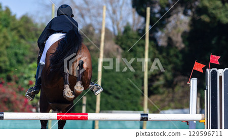 Show Jumping Horse Rider Jump Flight Rear Action Show Jumping Horse Rider Jump Flight Rear Action 129596711