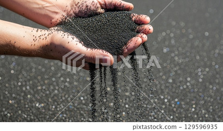 Hands holding black seeds with bokeh light background Hands holding black seeds with bokeh light background 129596935
