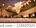 Empty wooden table top with lights bokeh on blur restaurant background. 129597225