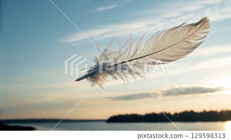 delicate feather floating gently in sky, symbolizing peace and freedom delicate feather floating gently in sky, symbolizing peace and freedom 129598313