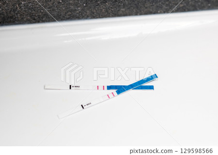 Results of a Pregnancy Test Displayed on a White Surface Results of a Pregnancy Test Displayed on a White Surface 129598566