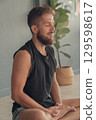 Man meditating in seated yoga pose. Concept of yoga, mindfulness and inner focus. 129598617