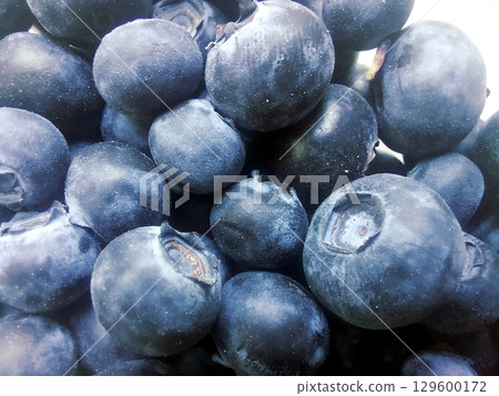Fresh Blueberries Piled Together for a Vibrant Display of Color and Texture Fresh Blueberries Piled Together for a Vibrant Display of Color and Texture 129600172
