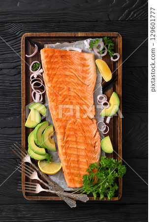 grilled whole salmon fillet on wooden board grilled whole salmon fillet on wooden board 129601777