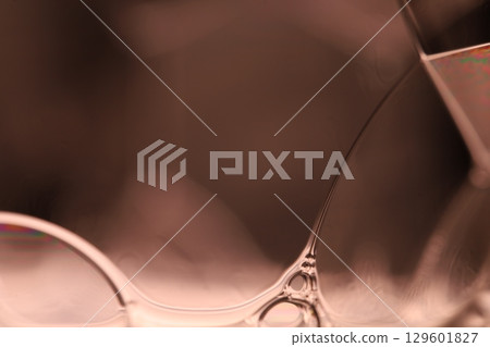 Green liquid film, fantastic bubbles connections, fluid movement, dark fantastic background, transparent oil, green ink 129601827